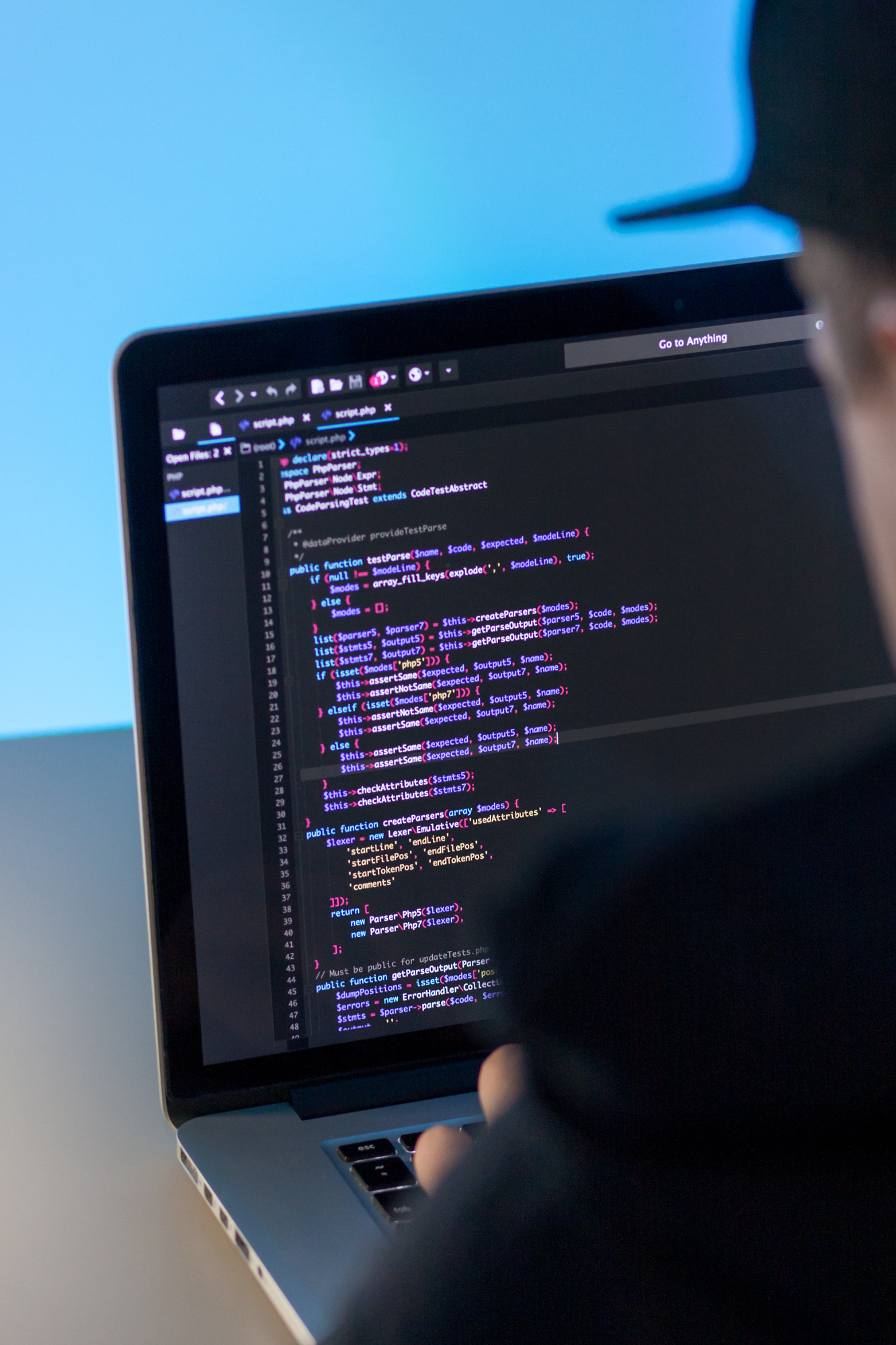 Software developer working on laptop at IT company office